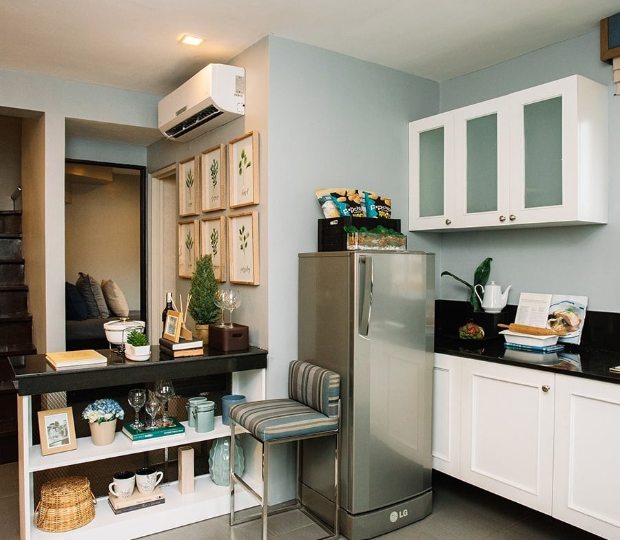 Ella home kitchen area with refrigerator