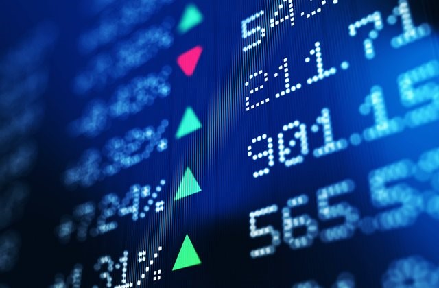 Financial data analysis graph showing stock market trends on a trading board.