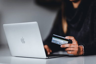 MacBook desktop with a card online purchase