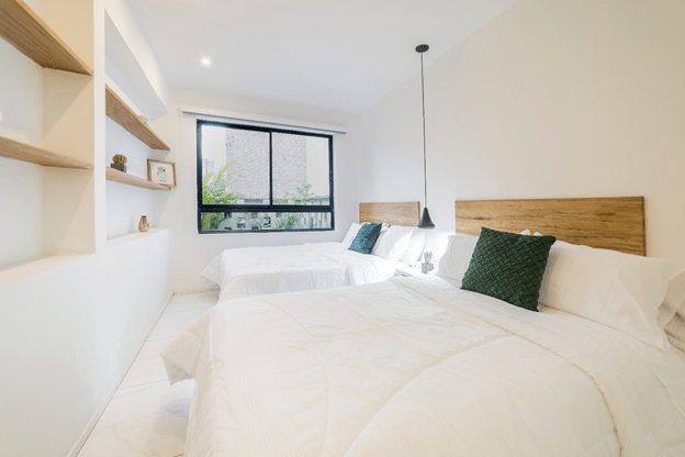 Convert your new room into a guest room. Photo by Lissete Laverde on Unsplash.