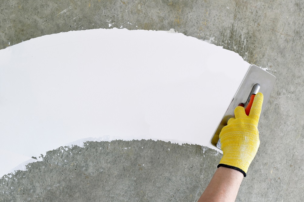 Apply a layer of concrete putty before painting