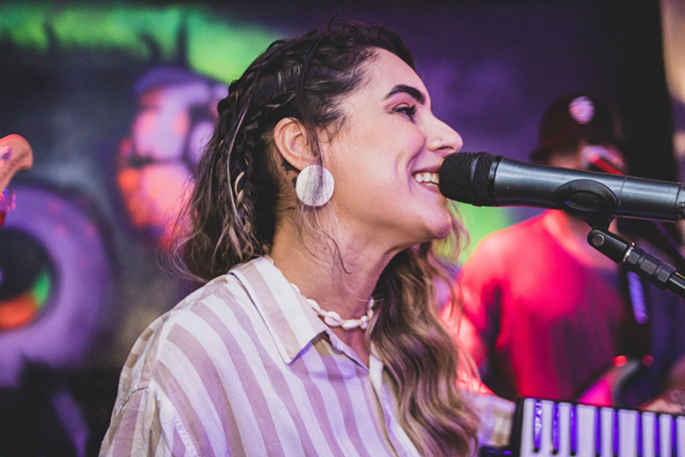 Enjoying a karaoke night Photo by Abstral Official on Unsplash