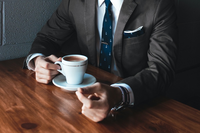 Property seller meeting professional connections in a cafe