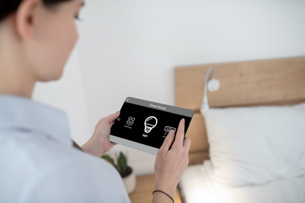 female-turning-light-using-remote-control