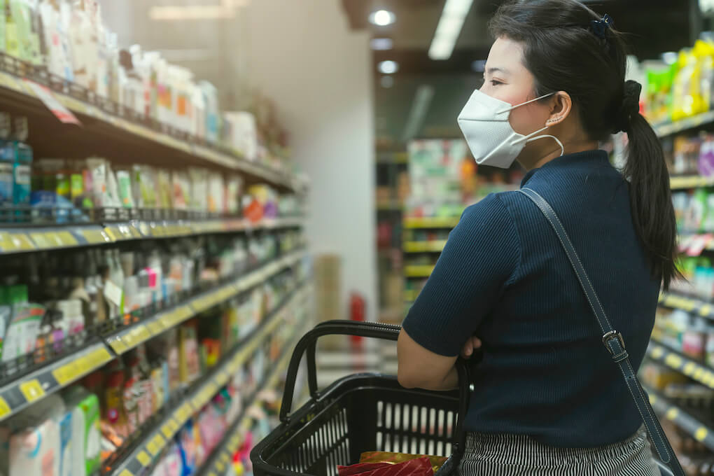 new-normal-after-covid-epidemic-young-smart-asian-female-shopping-new-lifestyle-supermarket-with-face-shild-mask-protection-hand-choose-consumer-products-new-normal-lifestyle