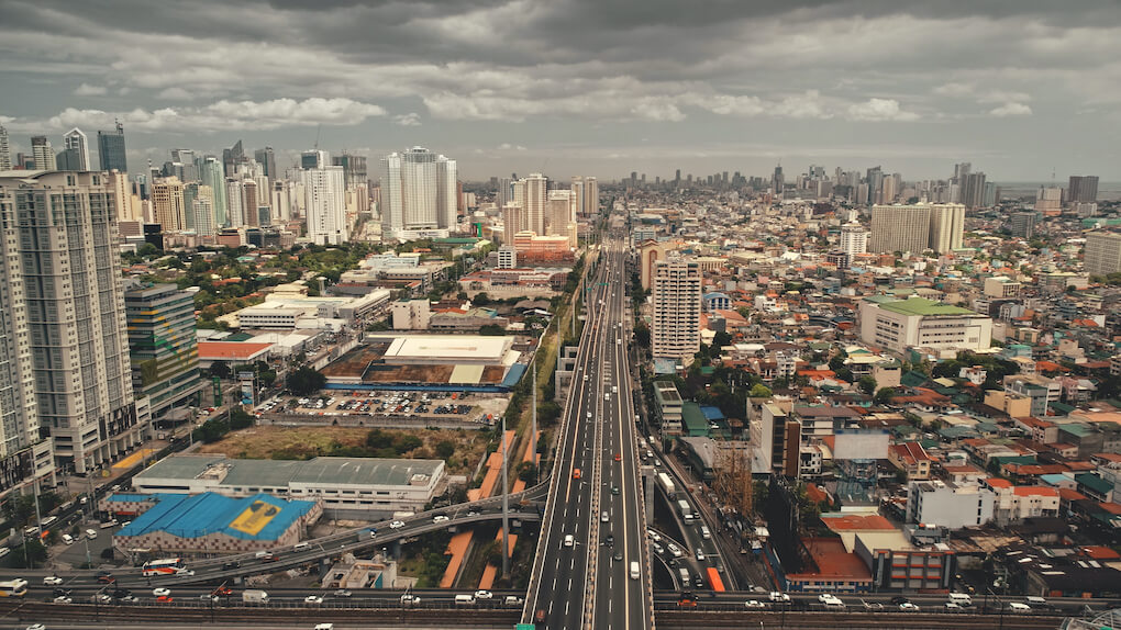 traffic-highway-modern-skyscrapers-aerial-epic-cityscape-with-streets-along-road-block