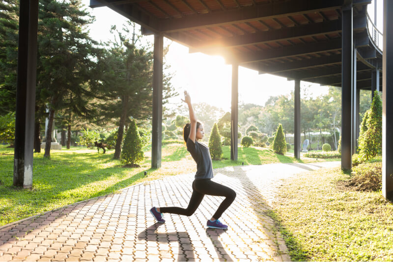 flexible woman stretching outdoors in camella manors upstate