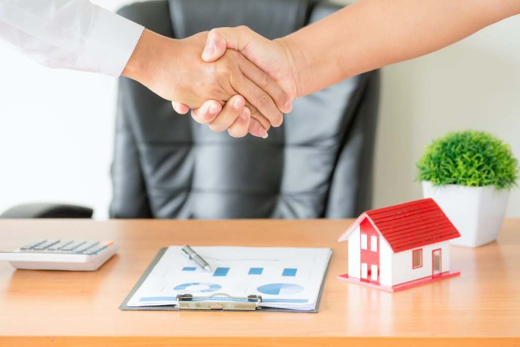 hands-agent-client-shaking-hands-after-signed-contract-buy-new-apartment
