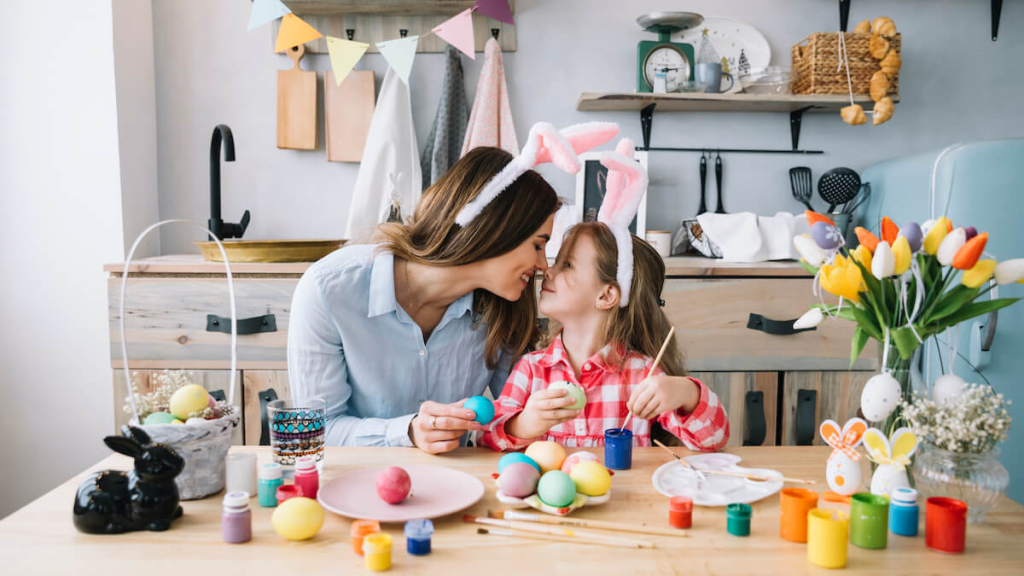 girl-mother-touching-noses-while-painting-eggs-easter(1)