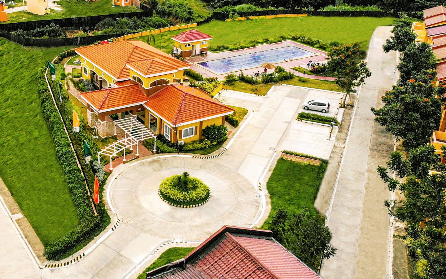 aerial shot of clubhouse and swimming pool amenities in camella homes in davao