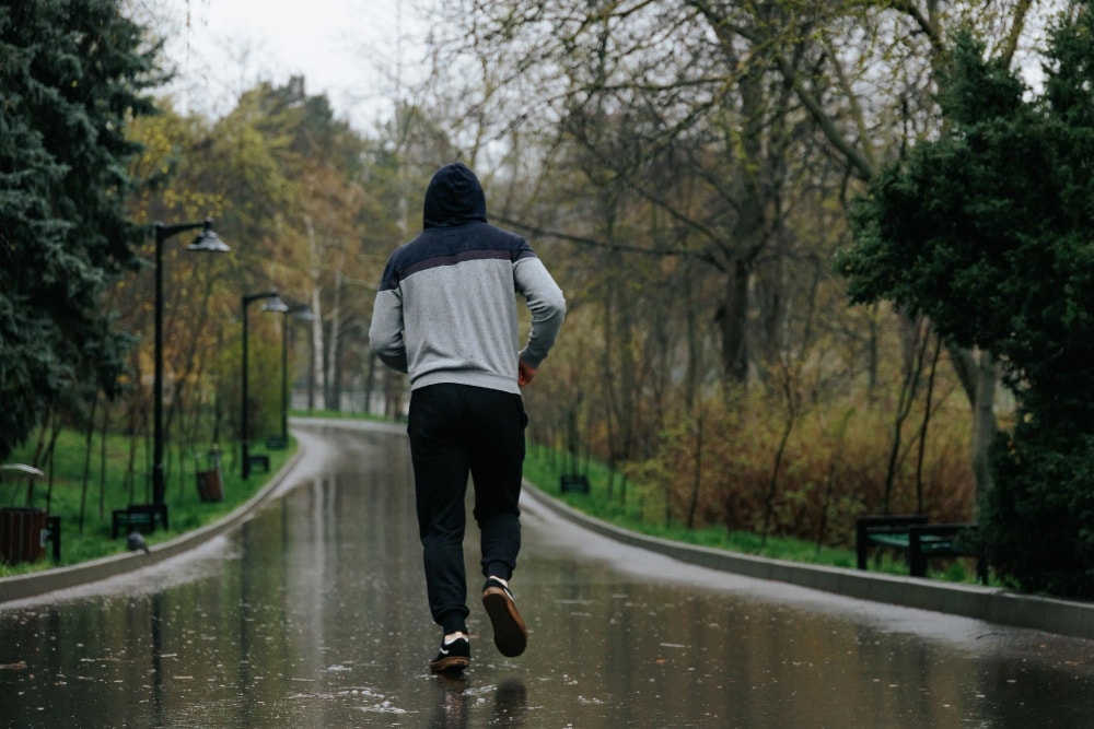 Running in the rain: Make sure you put on your running hat, avoid cotton to keep warm, and wear a good pair of socks to avoid soggy feet.