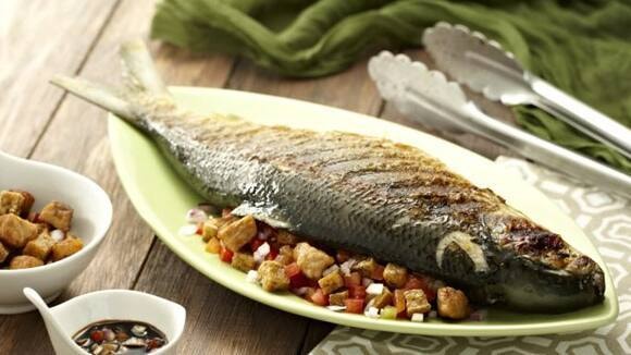 Filipino style fish cooked through charcoal grill