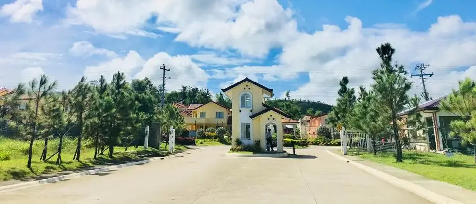 Camella's community in Capiz with entrance gate, clubhouse, jogging paths, parks, and open spaces.