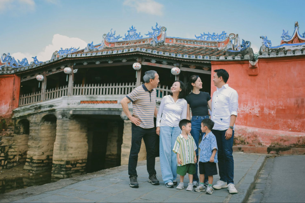 Family posing in front of a historic building